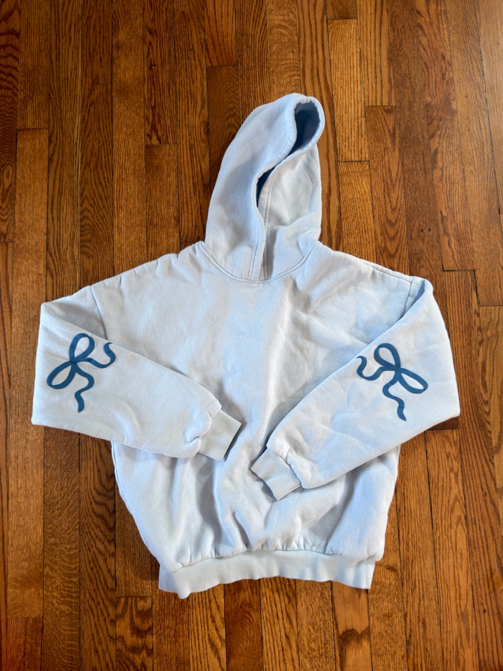 Edikted Light Blue Hoodie with Navy Bow Sleeve Prints